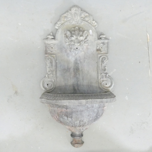 2685 - A lead Italian style wall mounted water fountain. 78x42x20cm.