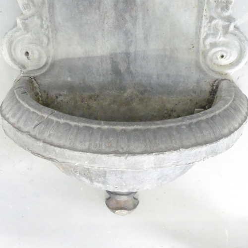 2685 - A lead Italian style wall mounted water fountain. 78x42x20cm.