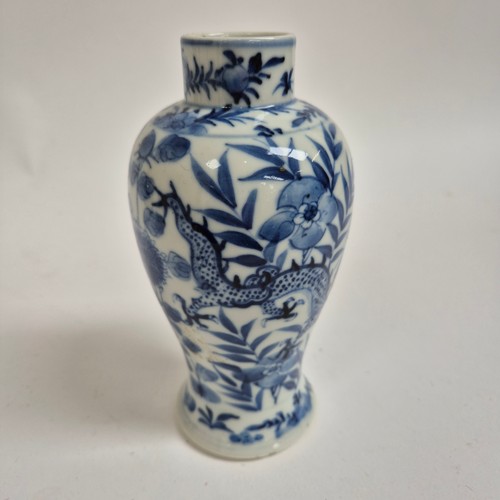 246 - A Chinese blue and white baluster vase, depicting 2 dragons facing with floral surroundings, 4 chara... 