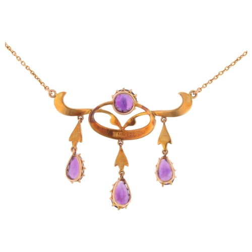 1100 - An Art Nouveau Edwardian 15ct gold amethyst and split pearl openwork pendant necklace, circa 1905, t... 