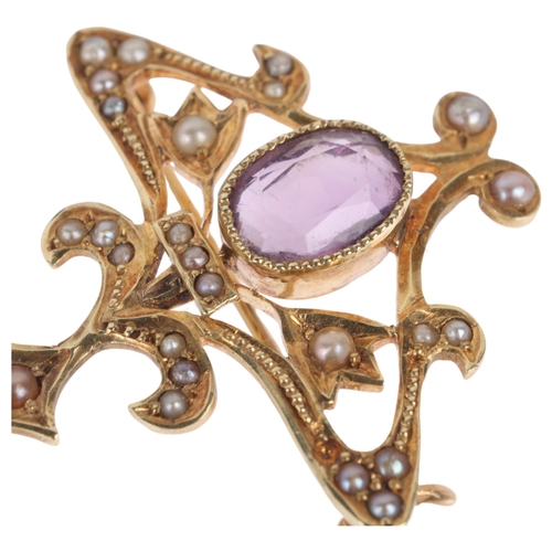 1101 - A 14ct gold amethyst and split pearl openwork brooch, in the Edwardian style, 31.7mm, 4.3g