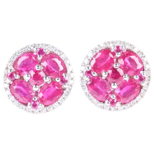 1103 - A pair of 18ct white gold ruby and diamond cluster earrings, maker V&Co, London 2014, set with round... 