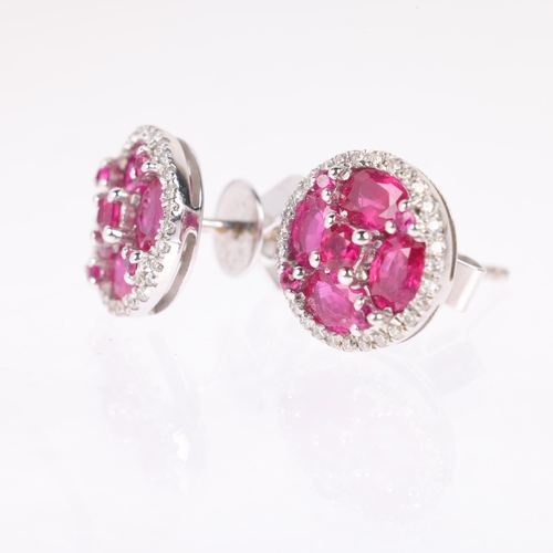 1103 - A pair of 18ct white gold ruby and diamond cluster earrings, maker V&Co, London 2014, set with round... 