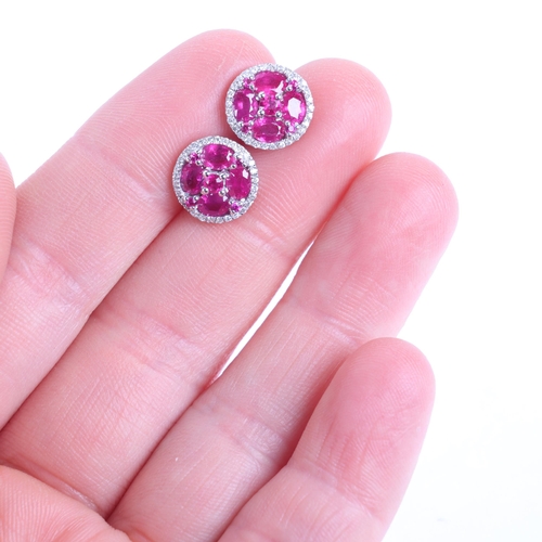 1103 - A pair of 18ct white gold ruby and diamond cluster earrings, maker V&Co, London 2014, set with round... 