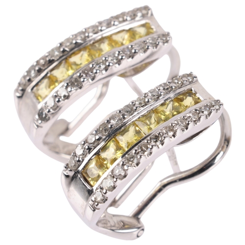 1106 - A pair of 9ct white gold yellow sapphire and diamond half hoop earrings, set with square-cut sapphir... 