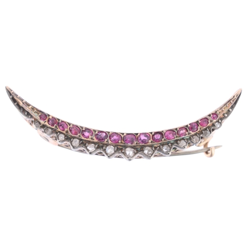 1112 - A Victorian ruby and diamond crescent brooch, circa 1890, set with oval mixed-cut rubies and rose-cu... 