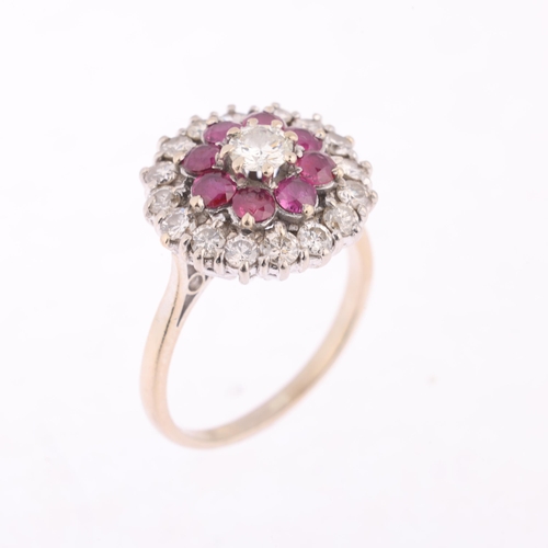 1113 - An 18ct gold ruby and diamond flowerhead cluster ring, claw set with round-cut rubies and modern rou... 