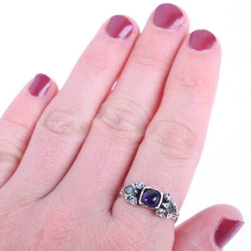 1114 - A Georgian amethyst chrysolite and diamond ring, centrally set with round cabochon amethyst flanked ... 