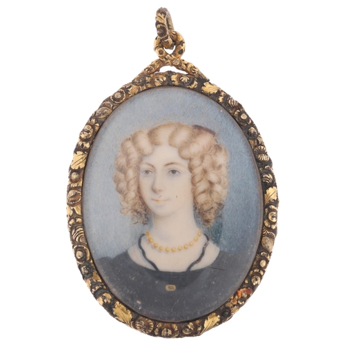 1124 - A large Georgian miniature portrait mourning pendant, circa 1800, the central miniature watercolour ... 