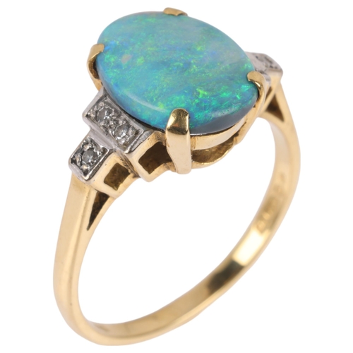 1128 - An 18ct gold black opal doublet and diamond dress ring, maker S&R, London 1975, claw set with oval c... 