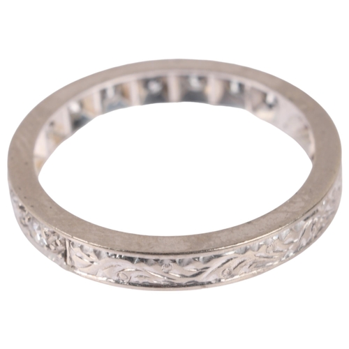 1130 - An Art Deco diamond half eternity ring, set with eight-cut diamonds and foliate engraved shank, tota... 