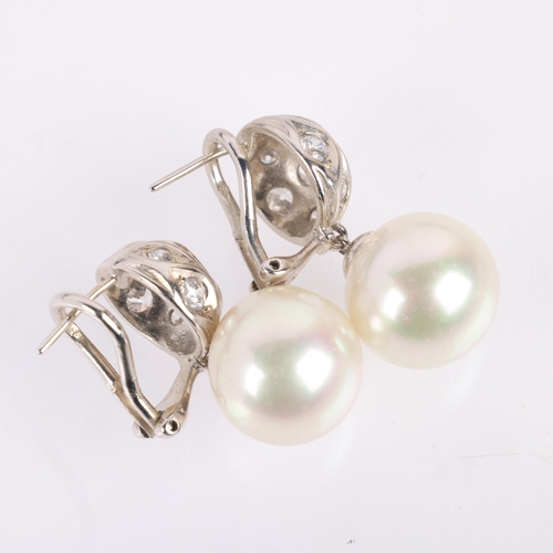 1139 - A pair of sterling silver whole cultured pearl and cubic zirconia drop earrings, with clip and post ... 