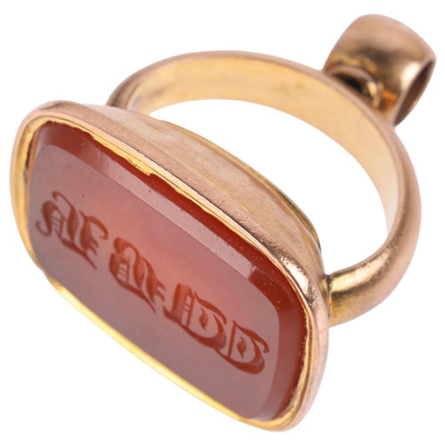 1144 - An Antique 9ct rose gold carnelian seal fob, the carnelian panel intaglio carved with initials WBH, ... 