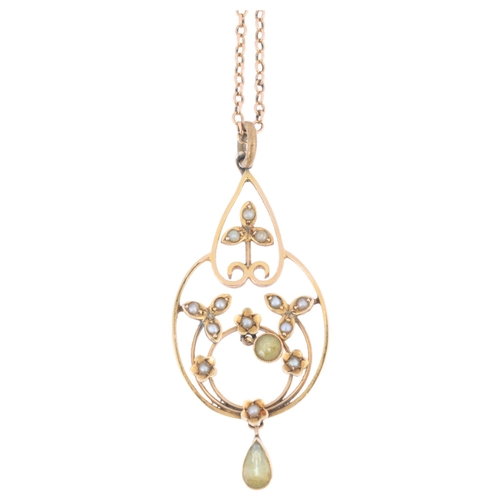 1150 - An Edwardian Art Nouveau 9ct gold peridot and split pearl openwork pendant necklace, on 15ct fine ca... 