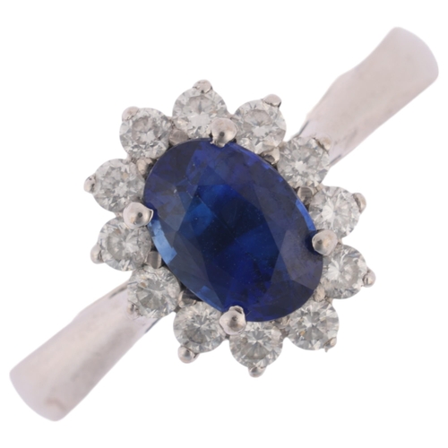 1157 - An 18ct white gold sapphire and diamond flowerhead cluster ring, by Browns, claw set with 1.15ct ova... 