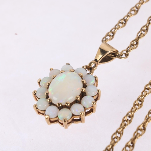 1159 - A 9ct gold opal flowerhead cluster pendant necklace, claw set with oval and round cabochon opals, on... 