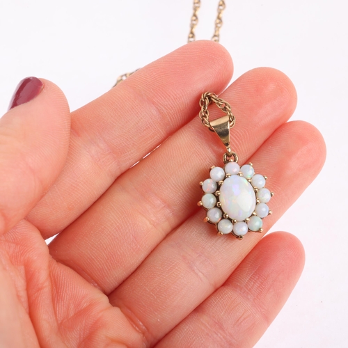 1159 - A 9ct gold opal flowerhead cluster pendant necklace, claw set with oval and round cabochon opals, on... 