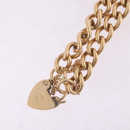 1165 - A 9ct gold solid curb link chain bracelet, maker BF&Co, Sheffield 1994 with 9ct heart padlock clasp,... 