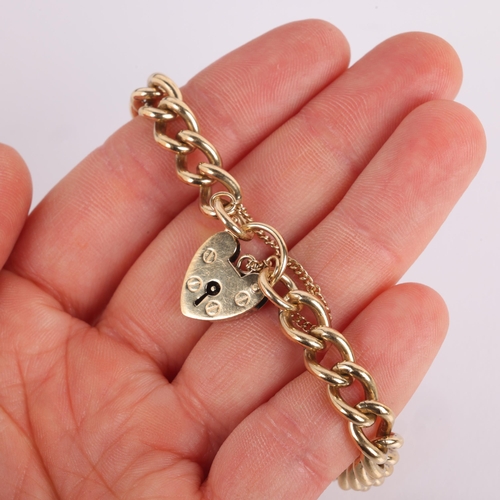 1165 - A 9ct gold solid curb link chain bracelet, maker BF&Co, Sheffield 1994 with 9ct heart padlock clasp,... 