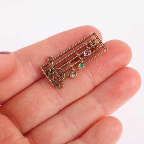 1166 - A Vintage 9ct gold gem set musical bar 'DEAR' brooch, maker RT, London 1991, set with diamond emeral... 