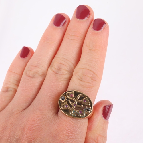 1176 - A Medieval style Germanic angel seal ring, set with cabochon black sapphires and round-cut rubies, a... 