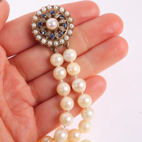 1177 - A Vintage 2-strand cultured pearl bead necklace, with unmarked gold sapphire and pearl flowerhead cl... 