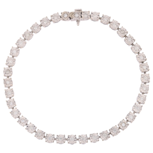 1182 - A 14ct white gold diamond tennis line bracelet, illusion set with modern round brilliant-cut diamond... 