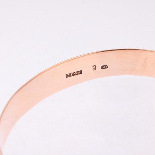 1189 - An Antique 9ct rose gold slave bangle, indistinct maker, floral engraved decoration, band width 11mm... 