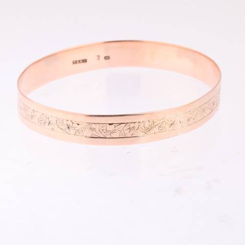 1189 - An Antique 9ct rose gold slave bangle, indistinct maker, floral engraved decoration, band width 11mm... 