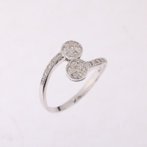 1201 - An 18ct white gold diamond cluster crossover ring, pave set with modern round brilliant-cut diamonds... 