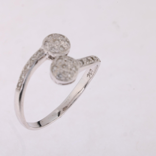 1201 - An 18ct white gold diamond cluster crossover ring, pave set with modern round brilliant-cut diamonds... 