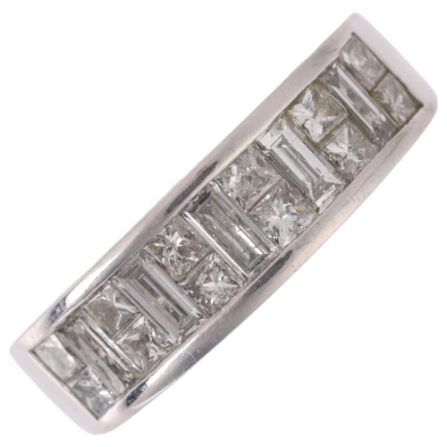 1204 - An 18ct white gold diamond half eternity ring, maker JSN, channel set with Princess and baguette-cut... 