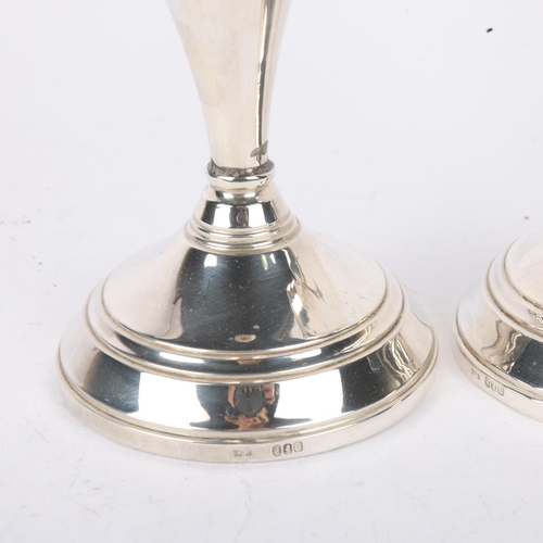 1694 - A pair of Elizabeth II silver table candlesticks, import London 1976, 14cm, loaded bases