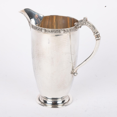 1698 - A George VI silver Celtic Revival cream jug, Adie Brothers Ltd, Birmingham 1937, 10cm, 3.2oz