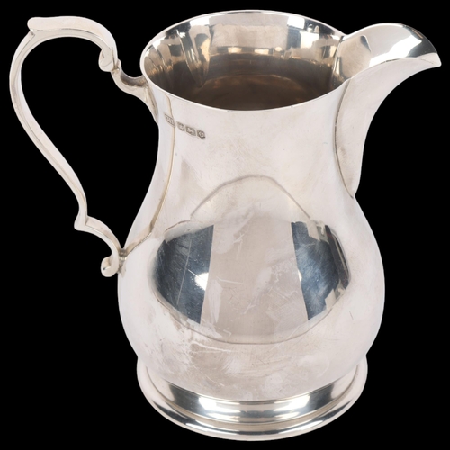 1699 - A George VI silver baluster cream jug, Harrison Brothers & Howson, Sheffield 1945, 10.5cm, 7oz