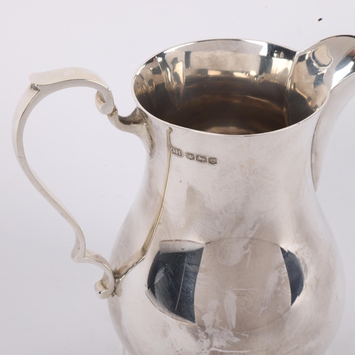 1699 - A George VI silver baluster cream jug, Harrison Brothers & Howson, Sheffield 1945, 10.5cm, 7oz