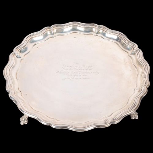 1704 - A George V circular silver salver, James Dixon & Sons, Sheffield 1913, pie crust rim raised on 4 cla... 