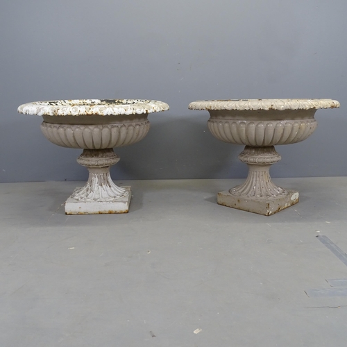 3000 - A pair of 19th century French painted cast iron garden tazza urns, with fluted detail and egg and to... 