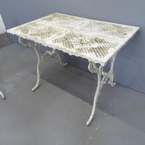 3003 - A 1930s Victorian style garden set comprising a table, 94x69x63cm, two matching chairs and a bench, ... 