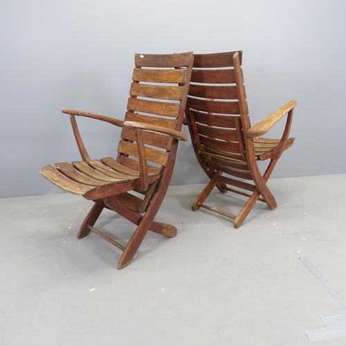 3006 - TRICONFORT - A pair of mid-century French teak slatted folding garden chairs.