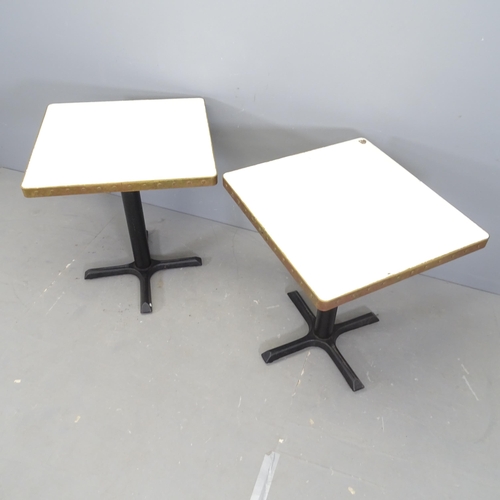 3014 - A pair of modern cafe tables, with laminated top surrounded by copper band and mounted on cast iron ... 