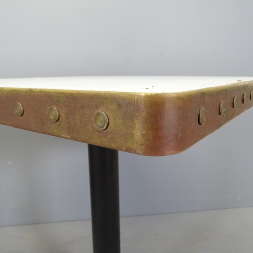 3014 - A pair of modern cafe tables, with laminated top surrounded by copper band and mounted on cast iron ... 