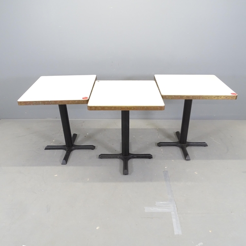 3016 - Three modern cafe tables, with laminated top surrounded by copper band and mounted on cast iron fram... 