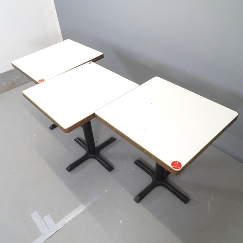 3016 - Three modern cafe tables, with laminated top surrounded by copper band and mounted on cast iron fram... 