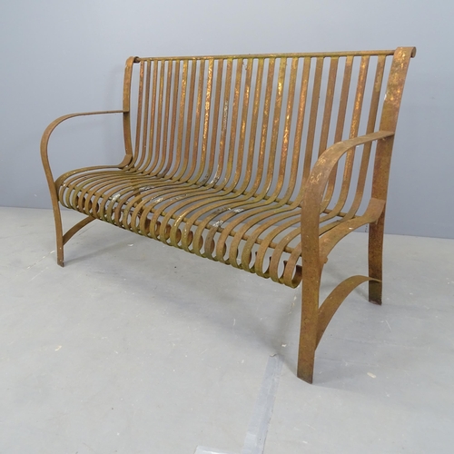 3030 - An antique wrought iron strapwork garden bench. 132x89x52cm.