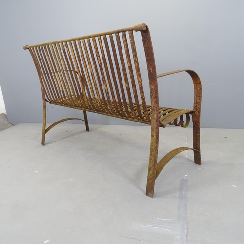 3030 - An antique wrought iron strapwork garden bench. 132x89x52cm.