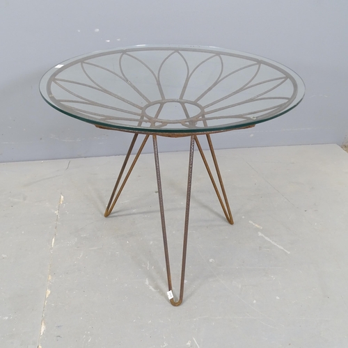 3038 - A mid-century wrought iron side table, the petal form structure with circular glass top and tripod h... 