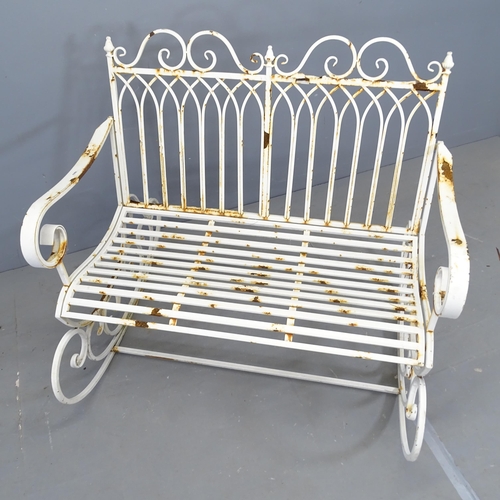 3041 - A painted cast metal rocking garden bench. 110x96x91cm.