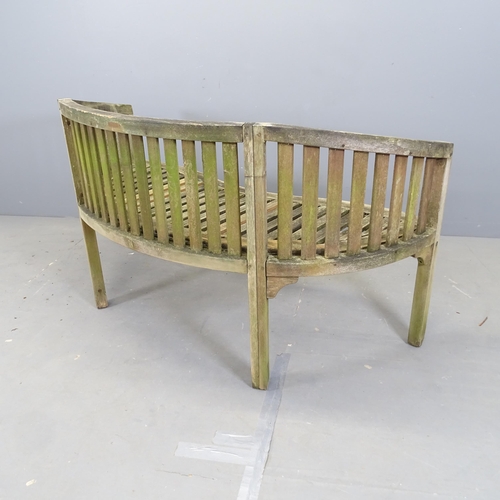 3045 - A weathered teak banana Lutyens style garden bench. Overall 151x83x65cm, seat 140x44x47cm.