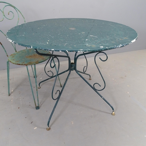 3049 - A painted metal circular topped garden table, 97x74cm, with five matching stacking chairs.